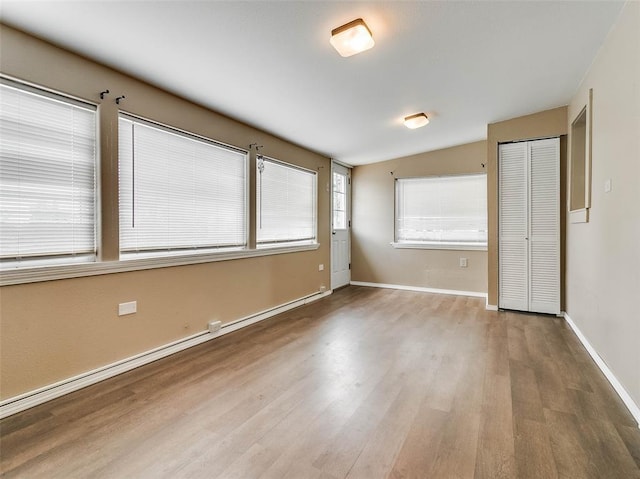 922 W 7th St, Stroud, OK 74079 - empty room featuring wood finished floors and baseboards