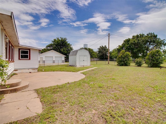 922 W 7th St, Stroud, OK 74079 - view of yard featuring an outbuilding, a garage, a patio area, and a storage unit