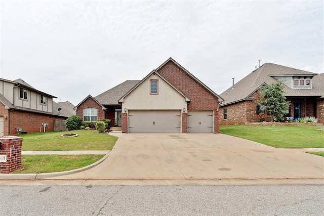 traditional-style home with brick siding, concrete driveway, a front yard, and an attached garage