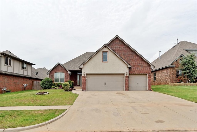 traditional-style house featuring driveway, brick siding, a front lawn, and stucco siding