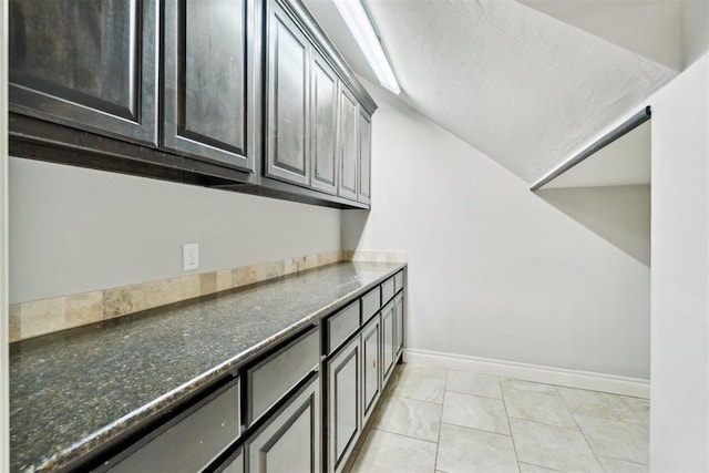 laundry room featuring baseboards