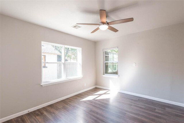 1717 N Kelham Ave, Oklahoma City, OK 73111 - spare room with ceiling fan, dark wood-style flooring, and baseboards
