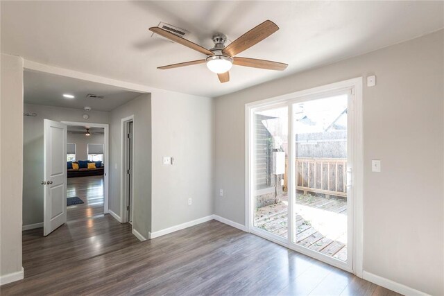 1717 N Kelham Ave, Oklahoma City, OK 73111 - empty room featuring ceiling fan, dark wood-style flooring, and baseboards