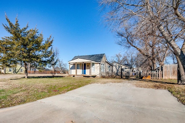view of side of property featuring a porch