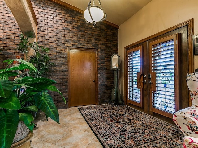 8501 S Council Rd, Oklahoma City, OK 73169 - entryway with lofted ceiling, french doors, brick wall, and tile patterned flooring