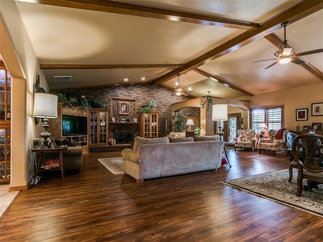 8501 S Council Rd, Oklahoma City, OK 73169 - living area with a ceiling fan, arched walkways, a fireplace, brick wall, and wood finished floors