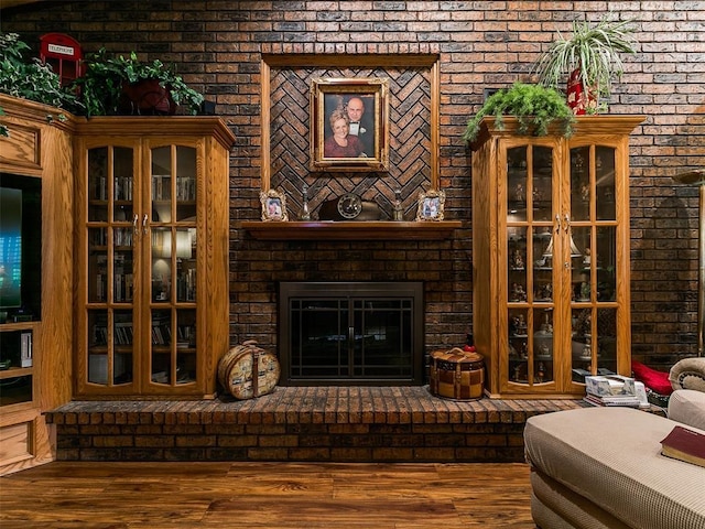 8501 S Council Rd, Oklahoma City, OK 73169 - living area featuring brick wall and wood finished floors