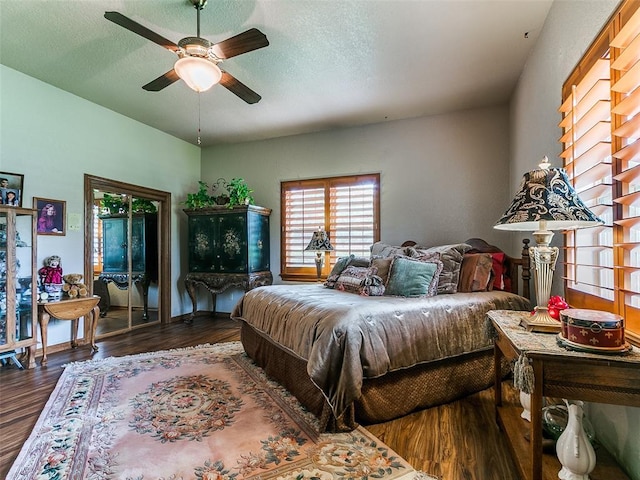8501 S Council Rd, Oklahoma City, OK 73169 - bedroom featuring wood finished floors, a ceiling fan, and a textured ceiling