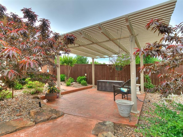 8501 S Council Rd, Oklahoma City, OK 73169 - fenced backyard featuring a hot tub, a pergola, and a patio