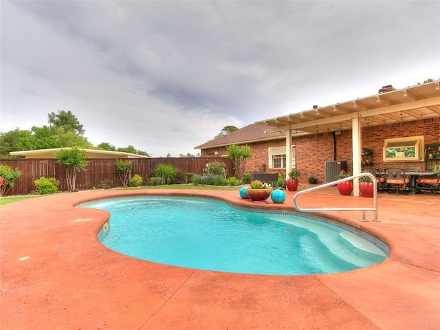 8501 S Council Rd, Oklahoma City, OK 73169 - view of pool featuring a patio area, a fenced backyard, and central air condition unit