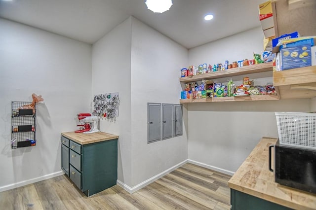 40202 Benson Park Rd, Shawnee, OK 74801 - bar area with light wood-type flooring, baseboards, black microwave, and recessed lighting