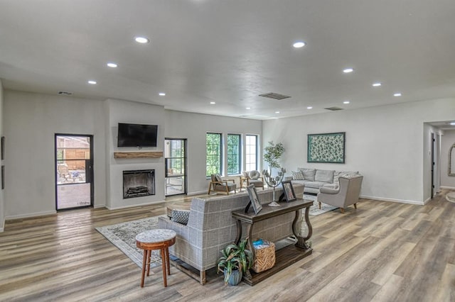40202 Benson Park Rd, Shawnee, OK 74801 - living room with wood finished floors, baseboards, a fireplace, and recessed lighting
