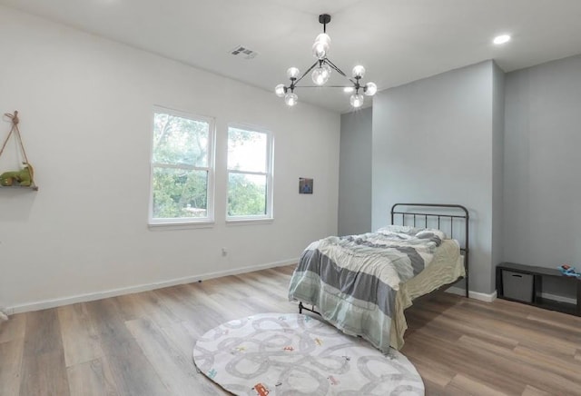 40202 Benson Park Rd, Shawnee, OK 74801 - bedroom featuring a chandelier, wood finished floors, and recessed lighting