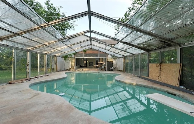 40202 Benson Park Rd, Shawnee, OK 74801 - indoor pool featuring a patio area, a diving board, and glass enclosure