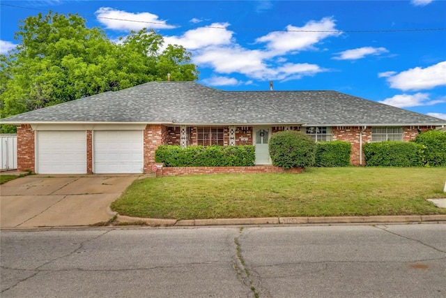 7108 S Kentucky St, Oklahoma City, OK 73159 - ranch-style house featuring an attached garage, brick siding, and a front yard