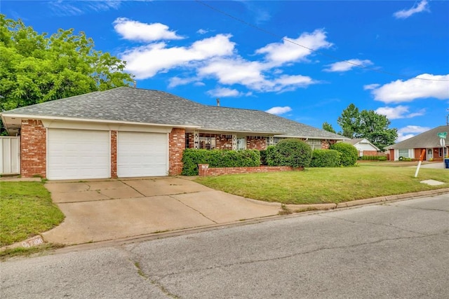 7108 S Kentucky St, Oklahoma City, OK 73159 - ranch-style house featuring an attached garage, brick siding, a front yard, and concrete driveway