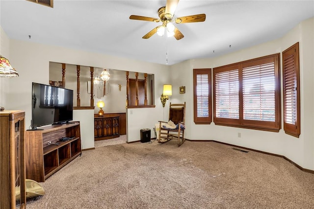7108 S Kentucky St, Oklahoma City, OK 73159 - living area featuring carpet flooring, baseboards, and a ceiling fan