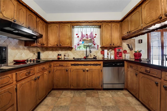 7108 S Kentucky St, Oklahoma City, OK 73159 - kitchen with stainless steel dishwasher, under cabinet range hood, brown cabinets, and a sink