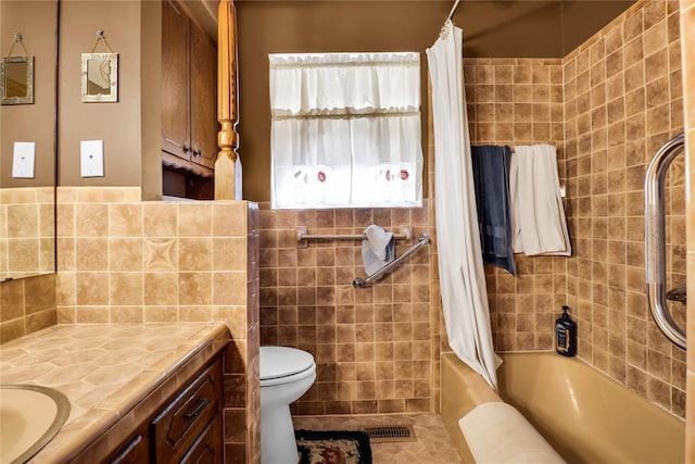 7108 S Kentucky St, Oklahoma City, OK 73159 - bathroom with vanity, toilet, shower / bath combo, tile walls, and tile patterned floors