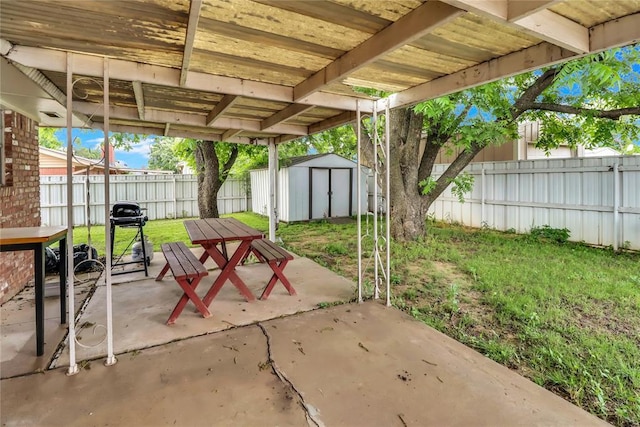 7108 S Kentucky St, Oklahoma City, OK 73159 - view of patio / terrace with a storage shed, an outbuilding, and area for grilling