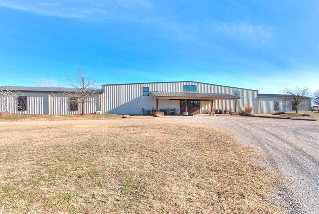 5400 N Piedmont Rd Unit A, Piedmont, OK 73078 - view of front facade with an outbuilding, driveway, and an outdoor structure