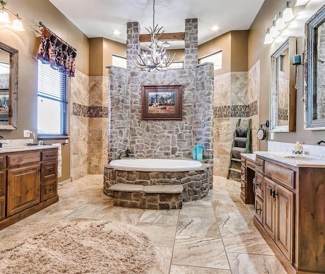 5400 N Piedmont Rd Unit A, Piedmont, OK 73078 - full bathroom with a bath, a chandelier, two vanities, and marble finish flooring