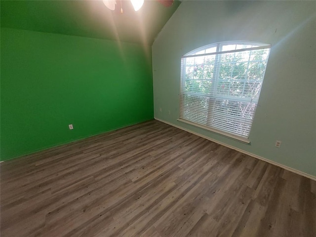 531 W Shadow Ridge Way, Mustang, OK 73064 - spare room with wood finished floors, vaulted ceiling, ceiling fan, and baseboards