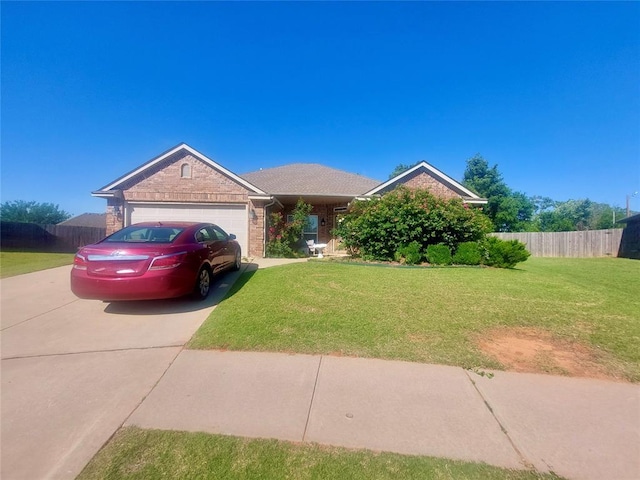 531 W Shadow Ridge Way, Mustang, OK 73064 - view of front of property with a garage, driveway, and brick siding