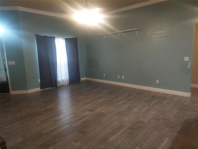 531 W Shadow Ridge Way, Mustang, OK 73064 - spare room with dark wood-style flooring, baseboards, and crown molding