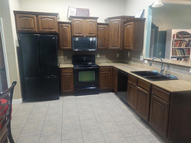 531 W Shadow Ridge Way, Mustang, OK 73064 - kitchen featuring black appliances, a sink, light countertops, and light tile patterned floors