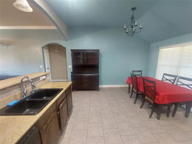 531 W Shadow Ridge Way, Mustang, OK 73064 - kitchen featuring a sink, arched walkways, vaulted ceiling, a chandelier, and dishwasher