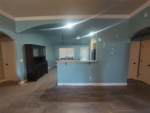 531 W Shadow Ridge Way, Mustang, OK 73064 - kitchen with stainless steel refrigerator, arched walkways, crown molding, a peninsula, and a chandelier