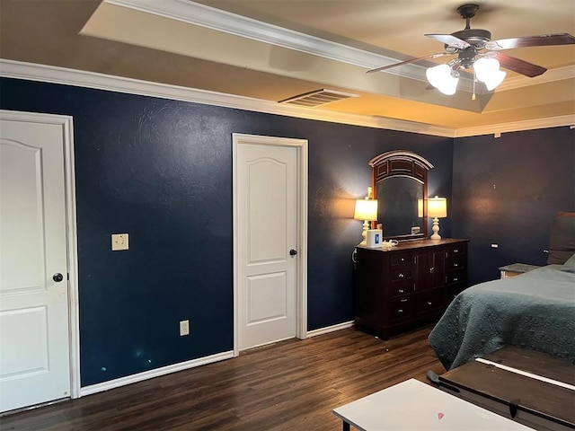 531 W Shadow Ridge Way, Mustang, OK 73064 - bedroom with a tray ceiling, wood finished floors, crown molding, baseboards, and ceiling fan