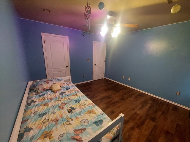 531 W Shadow Ridge Way, Mustang, OK 73064 - bedroom with dark wood-style floors, baseboards, and a ceiling fan