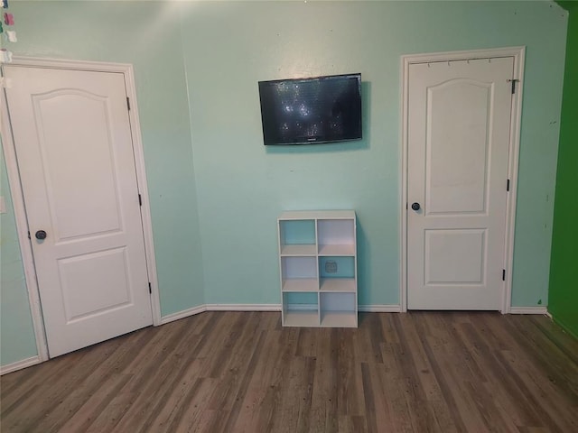 531 W Shadow Ridge Way, Mustang, OK 73064 - unfurnished bedroom featuring wood finished floors and baseboards