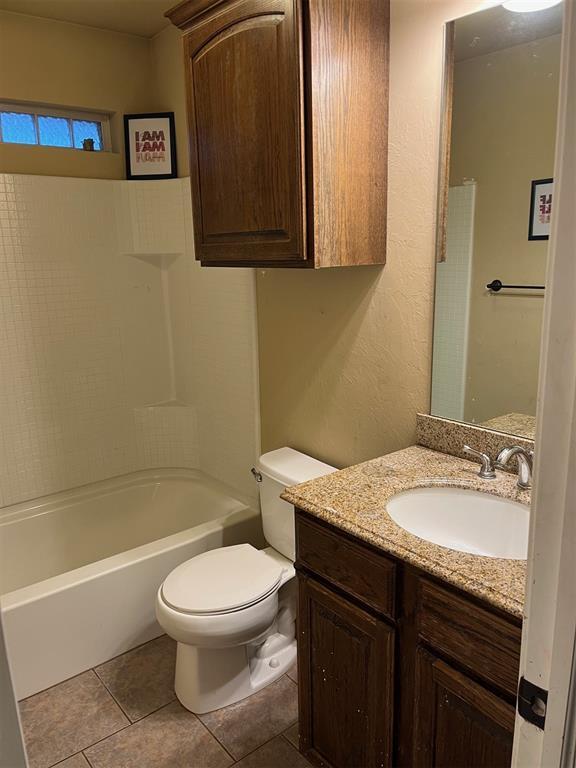 531 W Shadow Ridge Way, Mustang, OK 73064 - bathroom with vanity, toilet, tile patterned floors, and tub / shower combination