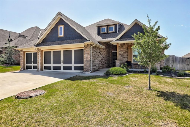 3024 Drake Crest Dr, Edmond, OK 73034 - view of front facade featuring driveway, brick siding, an attached garage, and roof with shingles