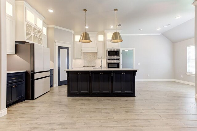 3024 Drake Crest Dr, Edmond, OK 73034 - kitchen with stainless steel appliances, light countertops, light wood finished floors, baseboards, and white cabinetry
