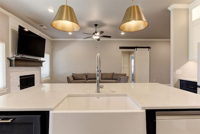 3024 Drake Crest Dr, Edmond, OK 73034 - kitchen with open floor plan, a sink, a barn door, ceiling fan, and dishwasher