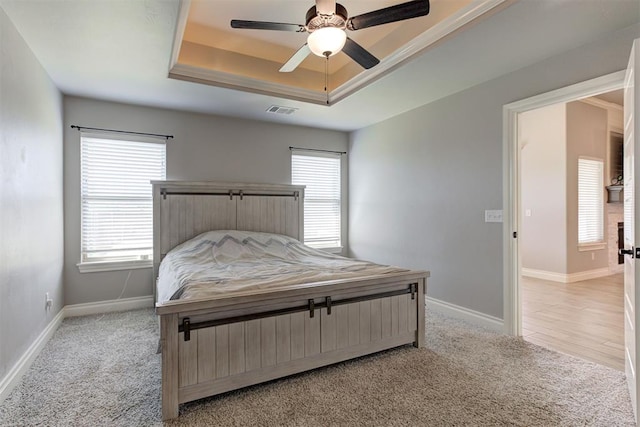 3024 Drake Crest Dr, Edmond, OK 73034 - bedroom featuring a raised ceiling, light colored carpet, and baseboards
