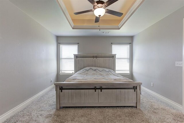 3024 Drake Crest Dr, Edmond, OK 73034 - bedroom featuring a raised ceiling, light colored carpet, baseboards, and a ceiling fan
