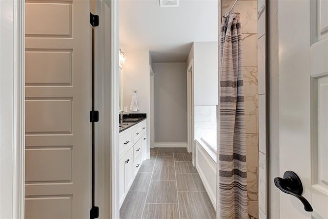 3024 Drake Crest Dr, Edmond, OK 73034 - bathroom featuring vanity and baseboards