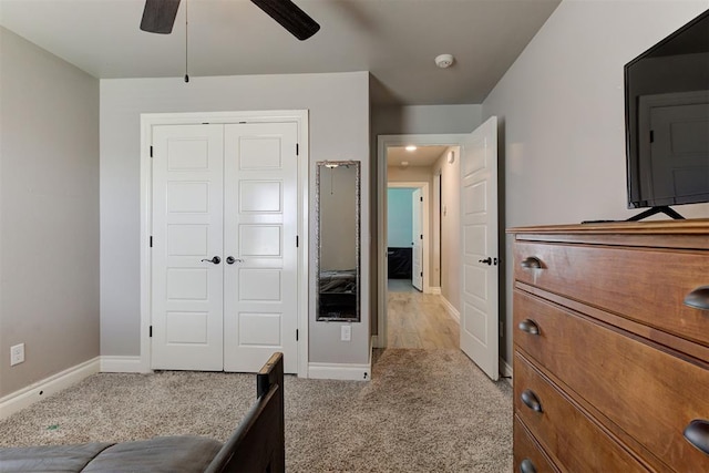 3024 Drake Crest Dr, Edmond, OK 73034 - bedroom featuring light carpet, baseboards, a closet, and ceiling fan