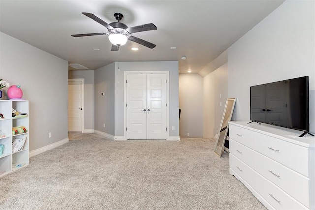 3024 Drake Crest Dr, Edmond, OK 73034 - unfurnished bedroom with light carpet, a closet, baseboards, and ceiling fan