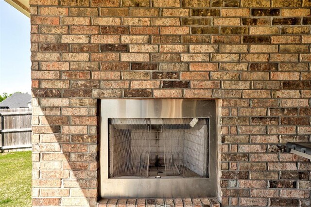 3024 Drake Crest Dr, Edmond, OK 73034 - detailed view of a fireplace and brick wall