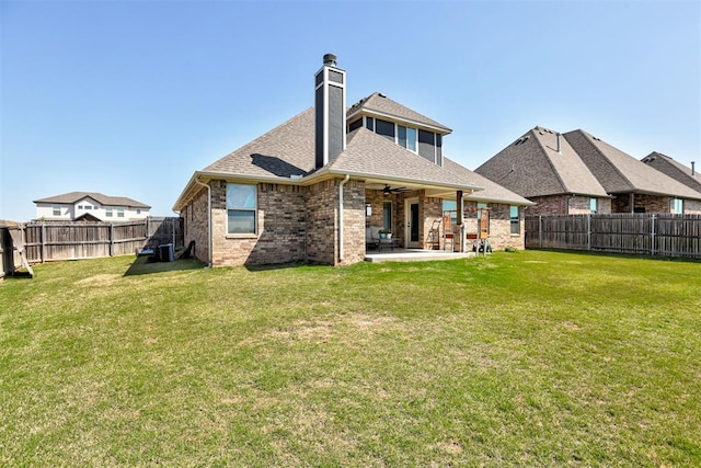 3024 Drake Crest Dr, Edmond, OK 73034 - back of house with a patio, ceiling fan, roof with shingles, a chimney, and brick siding