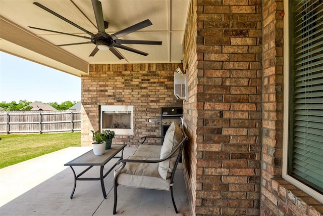 3024 Drake Crest Dr, Edmond, OK 73034 - view of patio / terrace with an outdoor brick fireplace, fence, and a ceiling fan