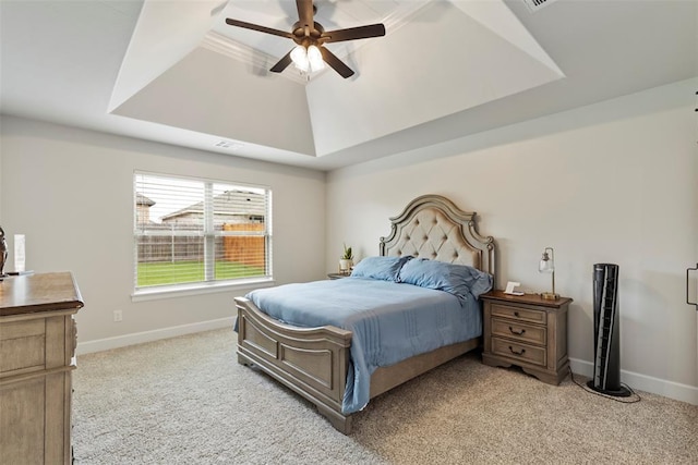 4705 Bermuda Dr, Mustang, OK 73064 - bedroom featuring light colored carpet, a tray ceiling, and baseboards