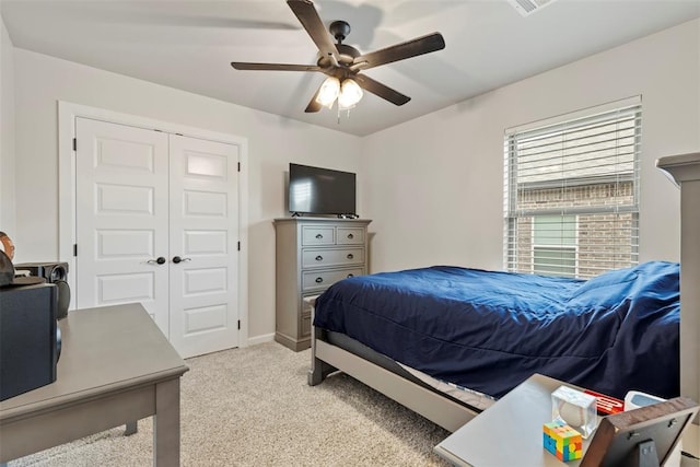 4705 Bermuda Dr, Mustang, OK 73064 - bedroom with light colored carpet, a closet, a ceiling fan, and baseboards