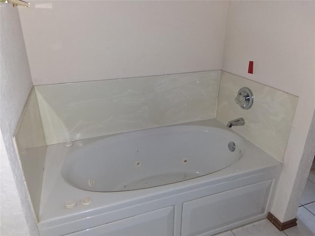824 SE 38th St, Moore, OK 73129 - bathroom with a tub with jets and tile patterned floors